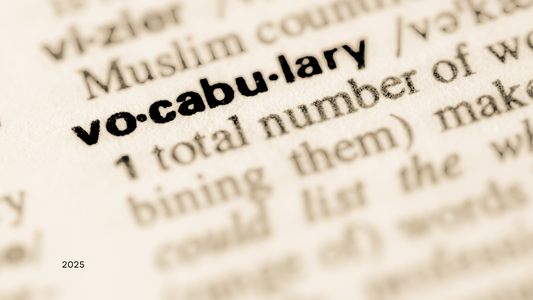 Close-up image of the word 'vocabulary' in a dictionary, highlighting the importance of scientific terminology and plant growth knowledge – Itsumi Botanicals 2025